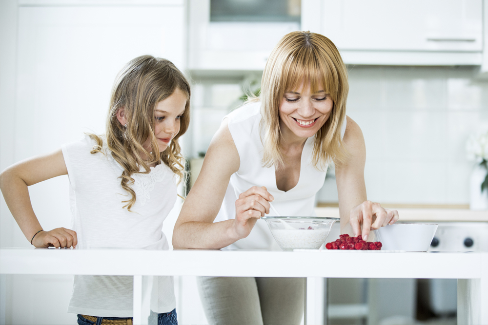 Mother and Daughter making muesli